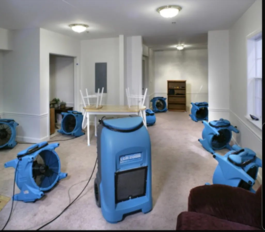 Air movers and dehumidifier setup for Water Damage Restoration in Napoleon